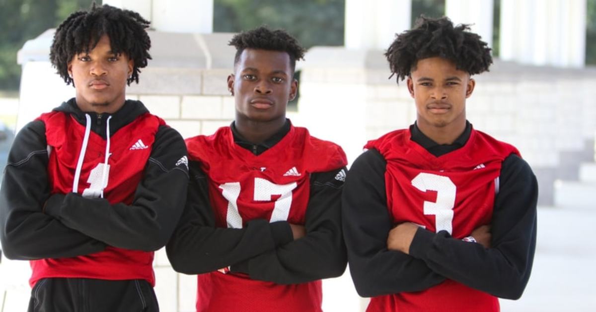 Jamar Owens taking a photo with his team mates. Left to right: Jamar Owens, Montrez Redding and Jontavius Wyman 